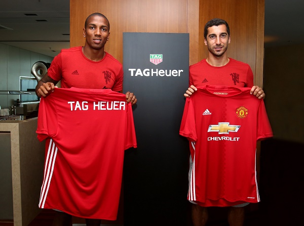 ashley young and henrikh mkhitaryan show off tag heuer branded jersey